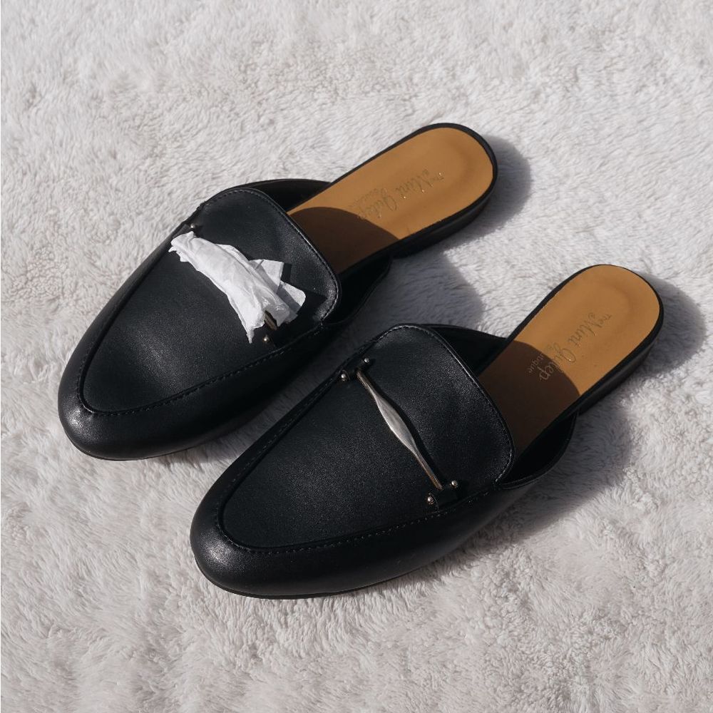 Stylish Black Mules by [Brand]